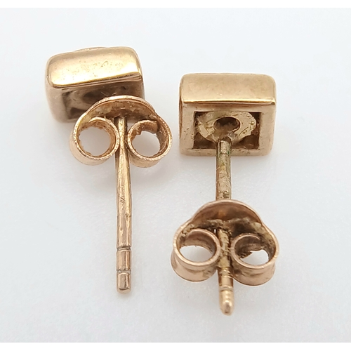 737 - A Pair of 9K Yellow Gold and Diamond Stud Earrings. 1.57g.