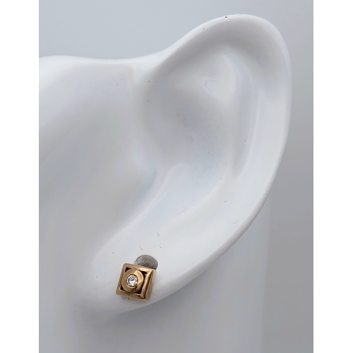 737 - A Pair of 9K Yellow Gold and Diamond Stud Earrings. 1.57g.