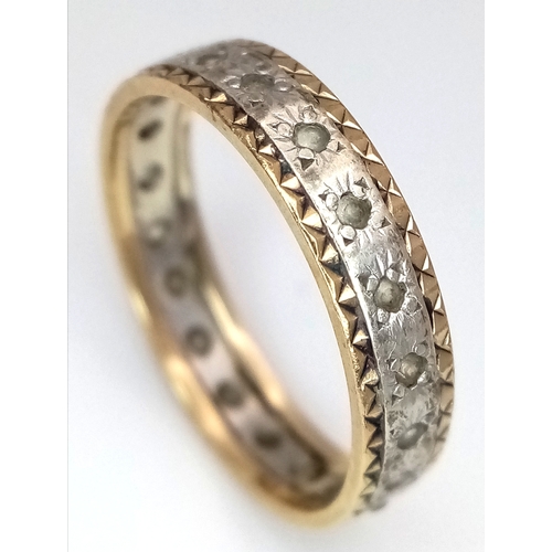772 - A 9K Yellow and White Gold, White Stone Eternity Ring. Size N. 2.25g.