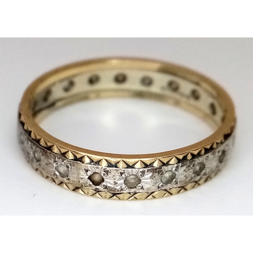 772 - A 9K Yellow and White Gold, White Stone Eternity Ring. Size N. 2.25g.