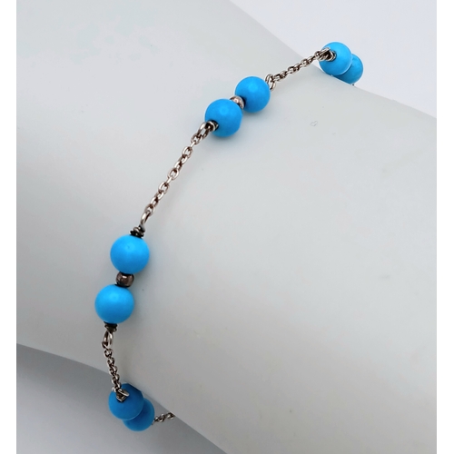 891 - A pretty Oliver Bonas 925 silver Turquoise link bracelet. Total weight 2.6G. Maximum length 22cm.