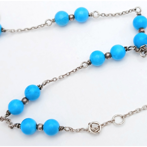 891 - A pretty Oliver Bonas 925 silver Turquoise link bracelet. Total weight 2.6G. Maximum length 22cm.