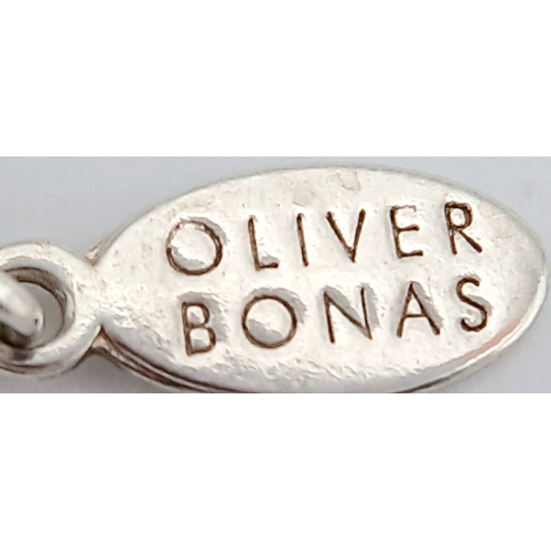 891 - A pretty Oliver Bonas 925 silver Turquoise link bracelet. Total weight 2.6G. Maximum length 22cm.