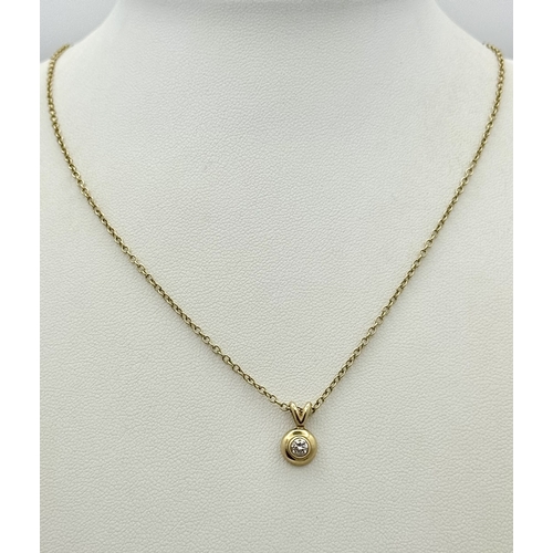 825 - A 9K Yellow Gold Diamond Pendant on a 9K Yellow Gold Chain. 1cm and 40cm. 2.5g. NL-27/61505.