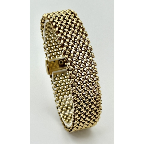 181 - A Glamourous Vintage 9K Yellow Gold Necklace and Bracelet Set. Intricate curved links create a stunn... 