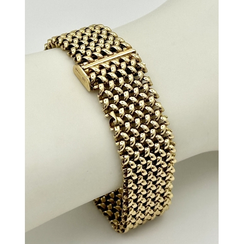 181 - A Glamourous Vintage 9K Yellow Gold Necklace and Bracelet Set. Intricate curved links create a stunn... 