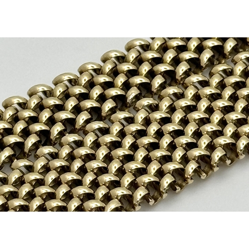 181 - A Glamourous Vintage 9K Yellow Gold Necklace and Bracelet Set. Intricate curved links create a stunn... 