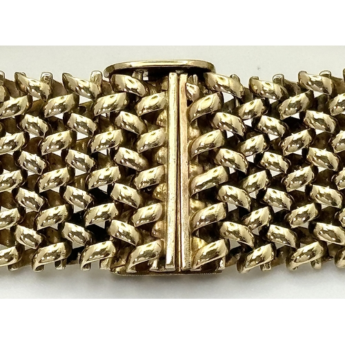 181 - A Glamourous Vintage 9K Yellow Gold Necklace and Bracelet Set. Intricate curved links create a stunn... 