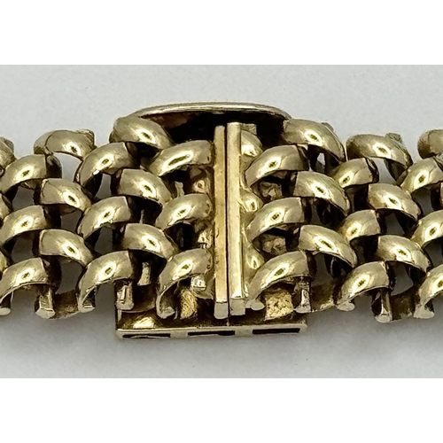 181 - A Glamourous Vintage 9K Yellow Gold Necklace and Bracelet Set. Intricate curved links create a stunn... 