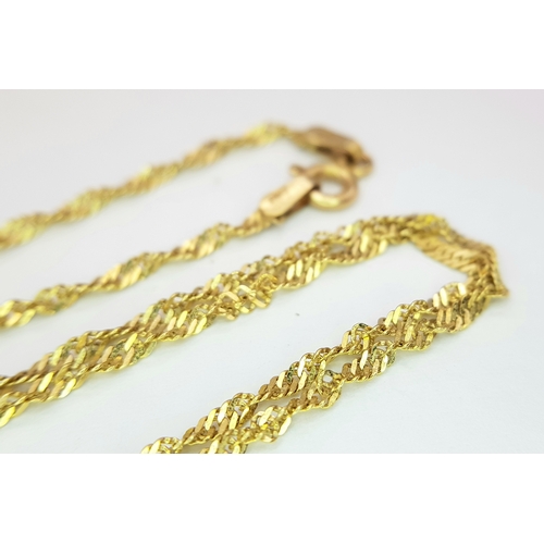 605 - A 50cms TWIST NECK CHAIN IN 14K GOLD WITH A PEARL PENDANT. 4.0gms