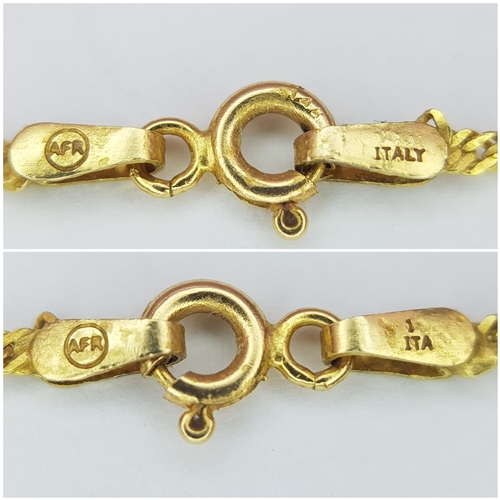 605 - A 50cms TWIST NECK CHAIN IN 14K GOLD WITH A PEARL PENDANT. 4.0gms