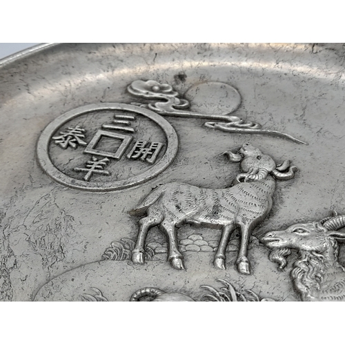 828 - A SUPERB VINTAGE/ANTIQUE CHINESE  WHITE METAL DISH DEPICTING  GOATS TO THE FRONT AND DRAGONS ON THE ... 