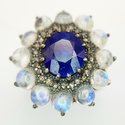 132 - A 2.6ct Blue Sapphire Ring with 3.2ct Moonstone and 0.20ctw of Old Cut Diamond Accents. Set in 925 S... 