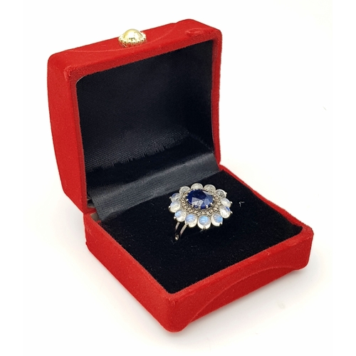 132 - A 2.6ct Blue Sapphire Ring with 3.2ct Moonstone and 0.20ctw of Old Cut Diamond Accents. Set in 925 S... 