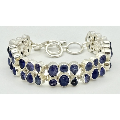 139 - A Gorgeous Double Row Tanzanite Gemstone Bracelet. Round and pear-shaped cuts. Set in 925 Silver. 38... 