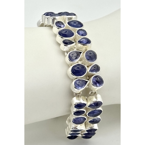 139 - A Gorgeous Double Row Tanzanite Gemstone Bracelet. Round and pear-shaped cuts. Set in 925 Silver. 38... 