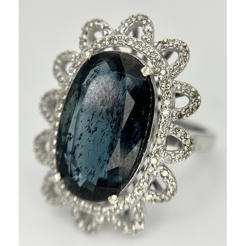 202 - A 5.6ct London Blue Topaz Ring with 1ctw of Diamond Accents. Set in 925 Silver. Size O. Comes with a... 