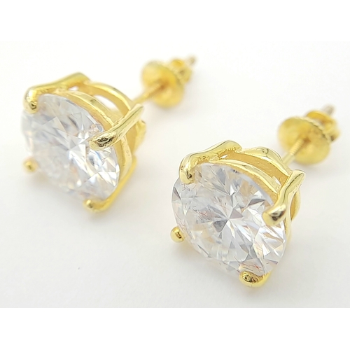 237 - A Pair of 6ctw White Moissanite Stud Earrings. Set in gilded 925 Silver. Comes with a case. CD-1979