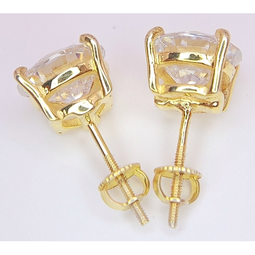 237 - A Pair of 6ctw White Moissanite Stud Earrings. Set in gilded 925 Silver. Comes with a case. CD-1979