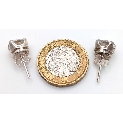 802 - A Pair of 5ctw White Moissanite Stud Earrings. Set in 925 gilded Silver. Comes with a case. CD-1980.