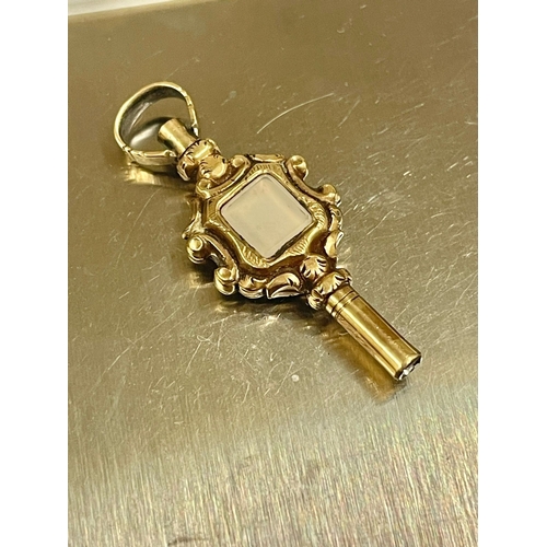851 - A yellow metal Victorian pocket watch key with gemstone. L10