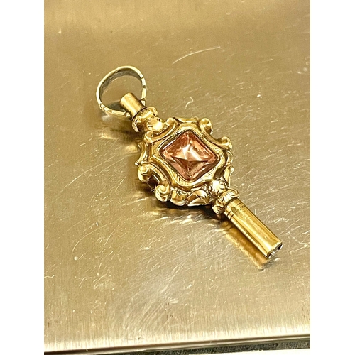 851 - A yellow metal Victorian pocket watch key with gemstone. L10