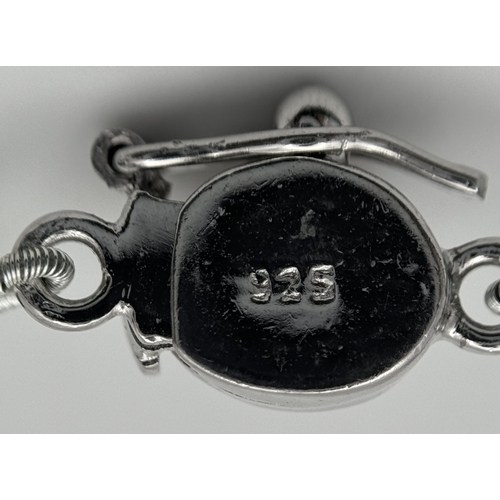 216 - A 200ct Graduating Emerald Rondelle Gemstone Necklace with a Ruby and 925 Silver Clasp. 42cm. CD-196... 