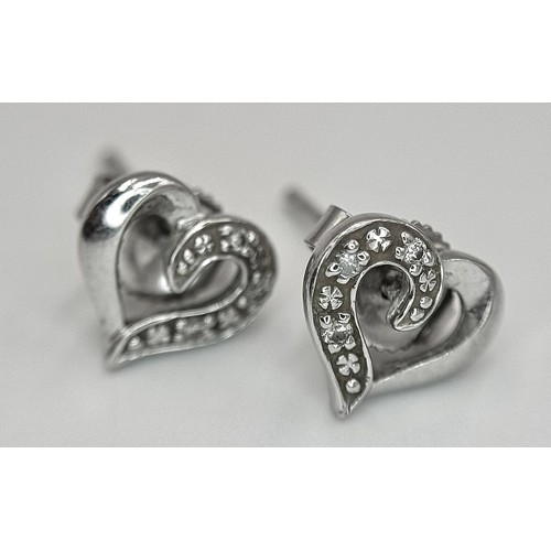 647 - A Pair of 9K White Gold Heart-Shaped Diamond Stud Earrings. 1.23g.