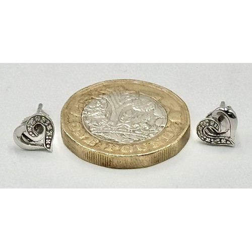 647 - A Pair of 9K White Gold Heart-Shaped Diamond Stud Earrings. 1.23g.