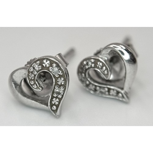 647 - A Pair of 9K White Gold Heart-Shaped Diamond Stud Earrings. 1.23g.