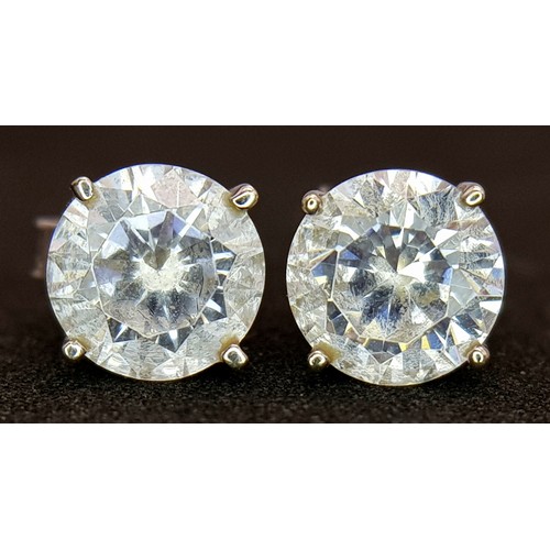 751 - A Pair of 9K White Gold White Stone Stud Earrings. 1.5g.