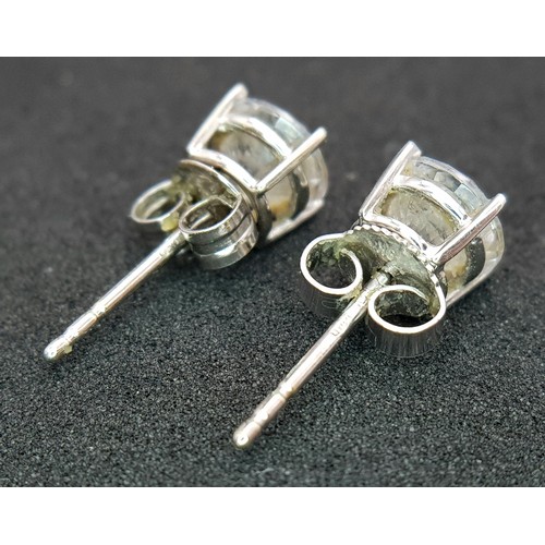 751 - A Pair of 9K White Gold White Stone Stud Earrings. 1.5g.