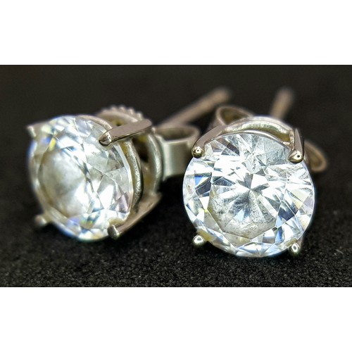 751 - A Pair of 9K White Gold White Stone Stud Earrings. 1.5g.