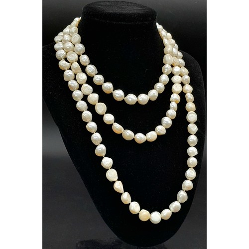 836 - A matinee length single strand of Freshwater Pearl beaded necklace. Total length 132cm.
