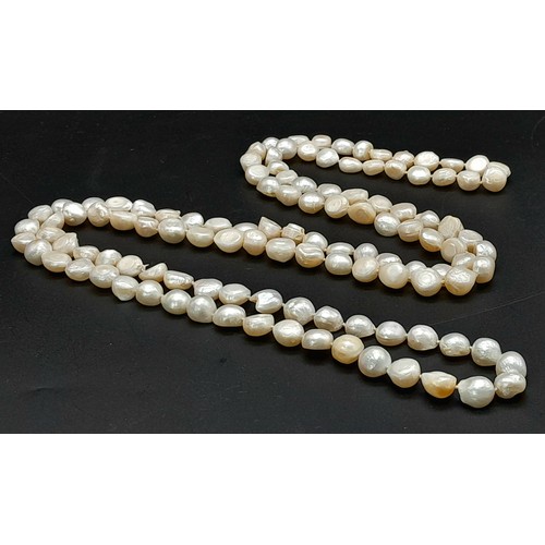 836 - A matinee length single strand of Freshwater Pearl beaded necklace. Total length 132cm.