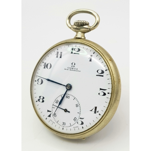 143 - A Vintage Omega White Metal Pocket Watch. 48mm diameter. White dial with second sub dial. Top winder... 