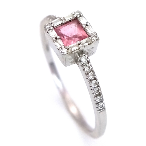 757 - An 18K White Gold, Diamond and Pink Sapphire Ring. Princess cut sapphire with baguette diamond surro... 