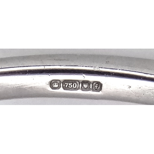 757 - An 18K White Gold, Diamond and Pink Sapphire Ring. Princess cut sapphire with baguette diamond surro... 