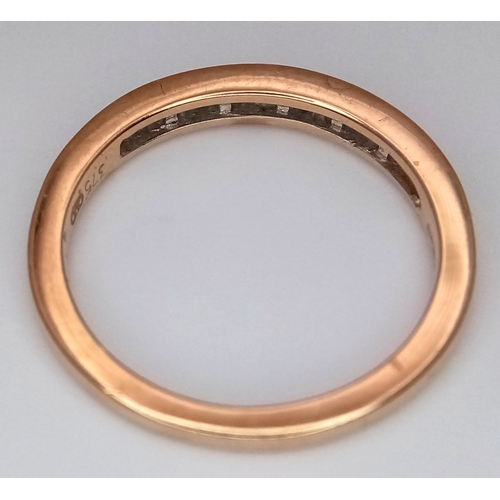 764 - A 9K Yellow Gold Diamond Half Eternity Ring. Tapered baguette channel set diamonds. Size L. 1.75g.