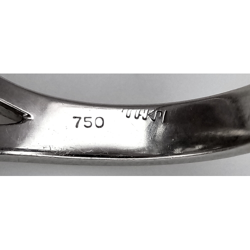 99 - An Art Deco Style Diamond and Sapphire Ring set in 18K White Gold. A 1.5ct round brilliant cut centr... 