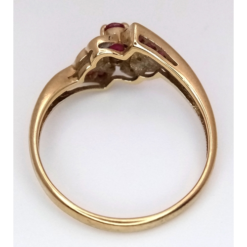 109 - A 9K Yellow Gold, Ruby and Diamond Crossover Ring. Size N 1/2. 2.13g.