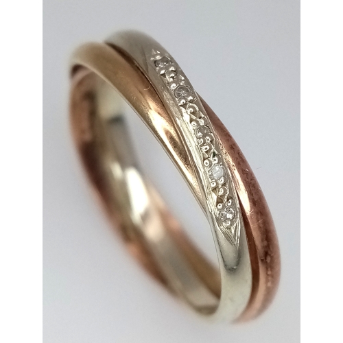 137 - A 9K Rose and White Gold Diamond Crossover Ring. Size N 1/2. 3.2g.