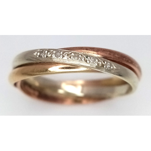 137 - A 9K Rose and White Gold Diamond Crossover Ring. Size N 1/2. 3.2g.