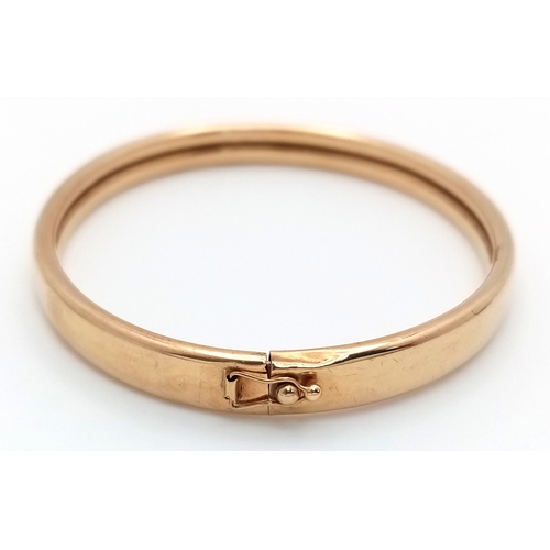157 - A 9K Yellow Gold (tests as) Bangle. 7mm width. 60mm interior diameter. 6.83g.