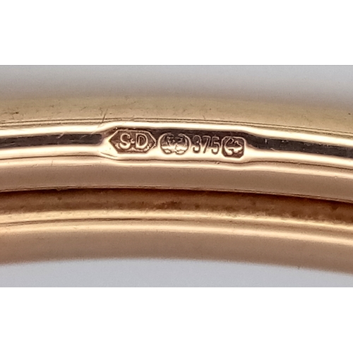 157 - A 9K Yellow Gold (tests as) Bangle. 7mm width. 60mm interior diameter. 6.83g.