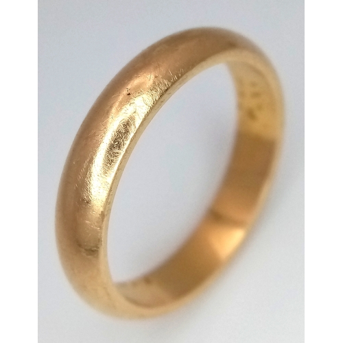 85 - An 18K Yellow Gold Band Ring. 5mm width. Size T. 7.05g.