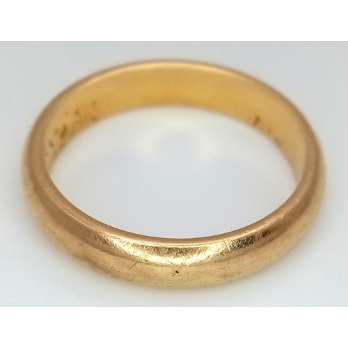 85 - An 18K Yellow Gold Band Ring. 5mm width. Size T. 7.05g.