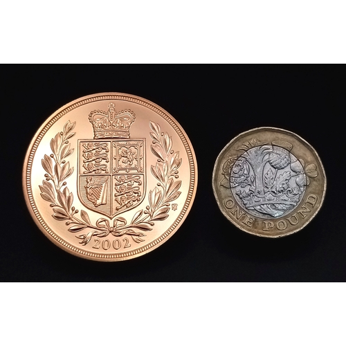 101 - A Royal Mint 2002 United Kingdom Brilliant Uncirculated Five-Pound Coin. The obverse of the coin is ... 