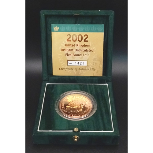 101 - A Royal Mint 2002 United Kingdom Brilliant Uncirculated Five-Pound Coin. The obverse of the coin is ... 