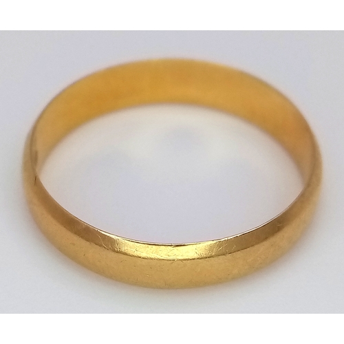 116 - An 18K Yellow Gold Band Ring. 4mm width. Size K 1/2. 2g.